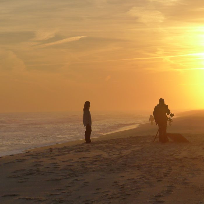 Filming on the beach at sunrise